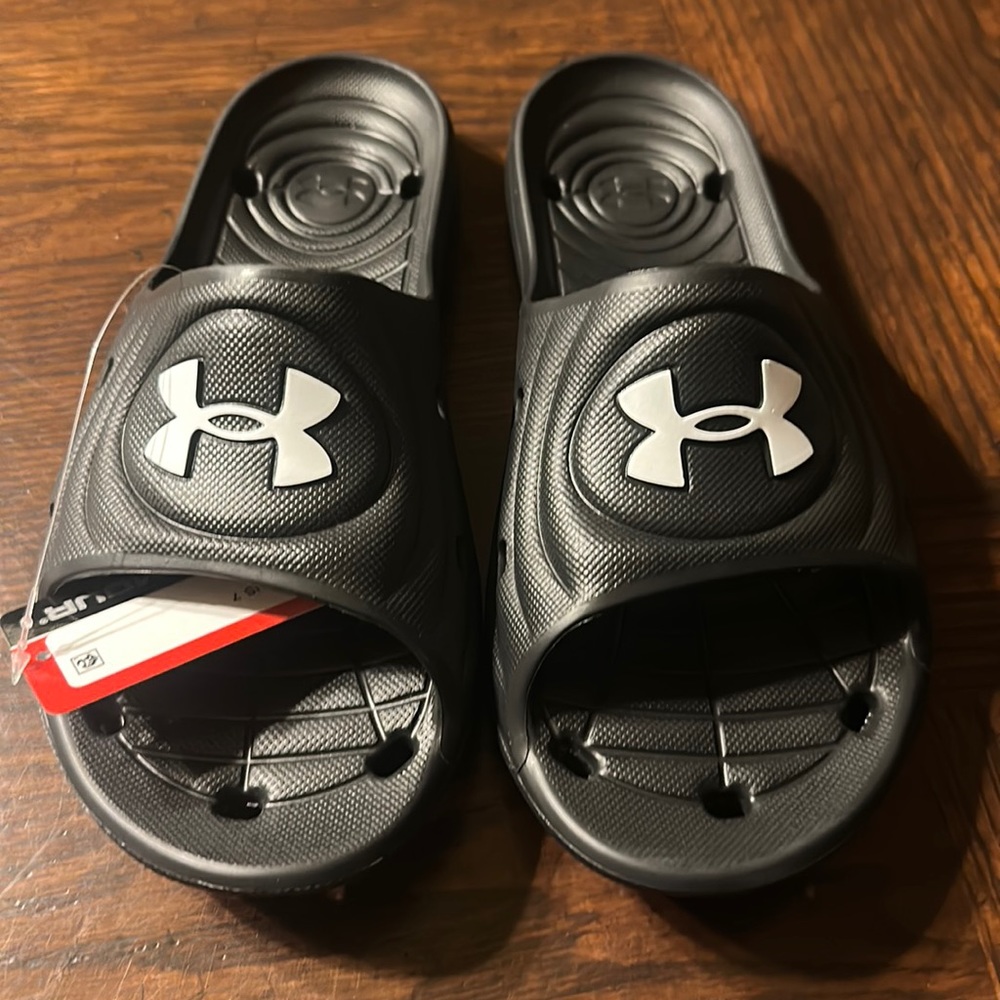 New with tags Under Armor slides.   Size 7 or size 9